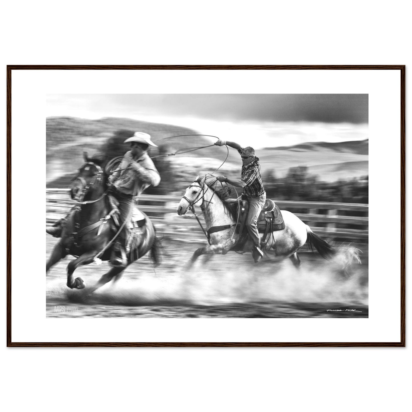Black & white print of two cowboys wrangling in close contact in a corall.