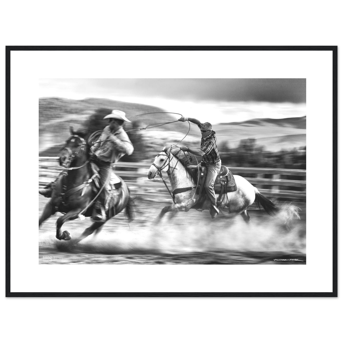 Black & white  print of two cowboys wrangling in close contact in a corall.