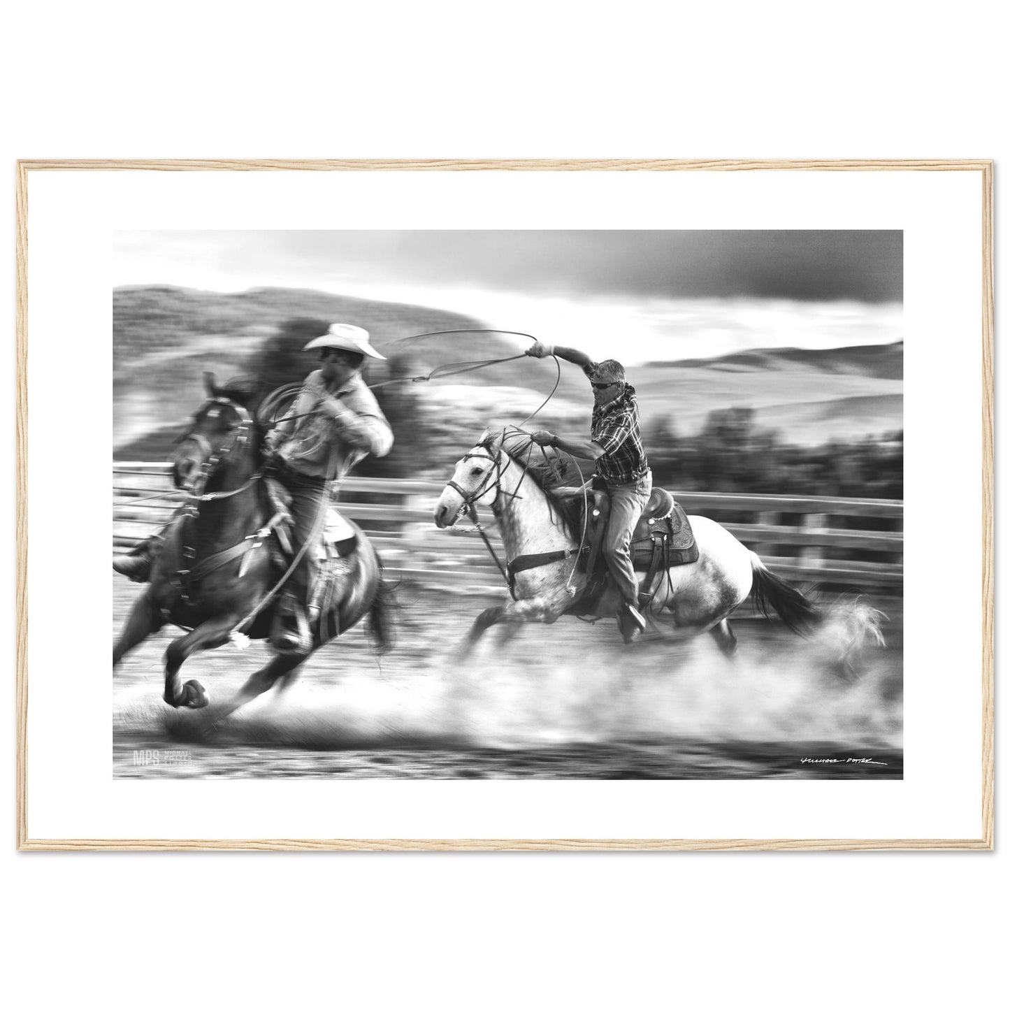 Black & white  print of two cowboys wrangling in close contact in a corall.